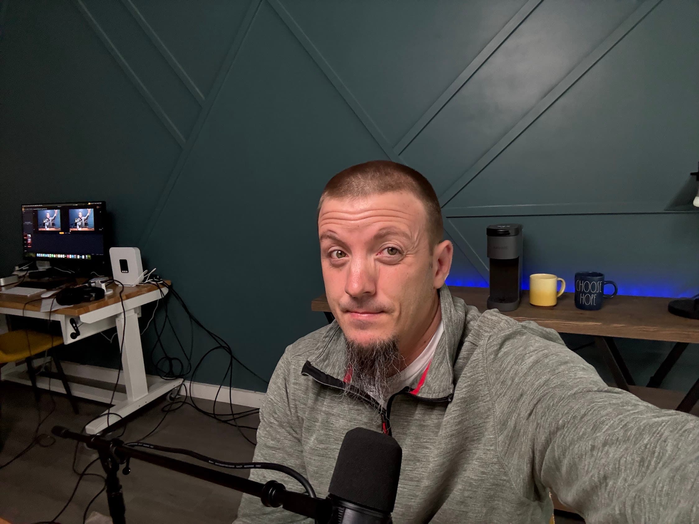 Justin at his desk workspace