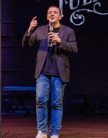 Justin Franich delivering a recovery and faith message at a speaking engagement