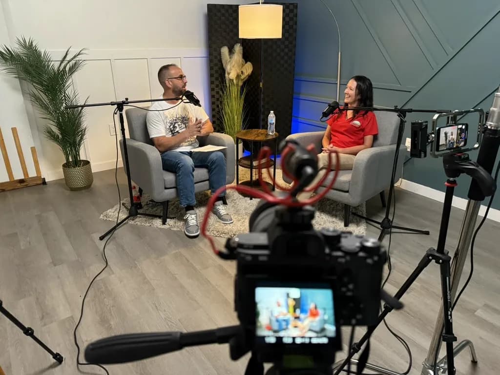 Home studio interview seen through a camera viewfinder