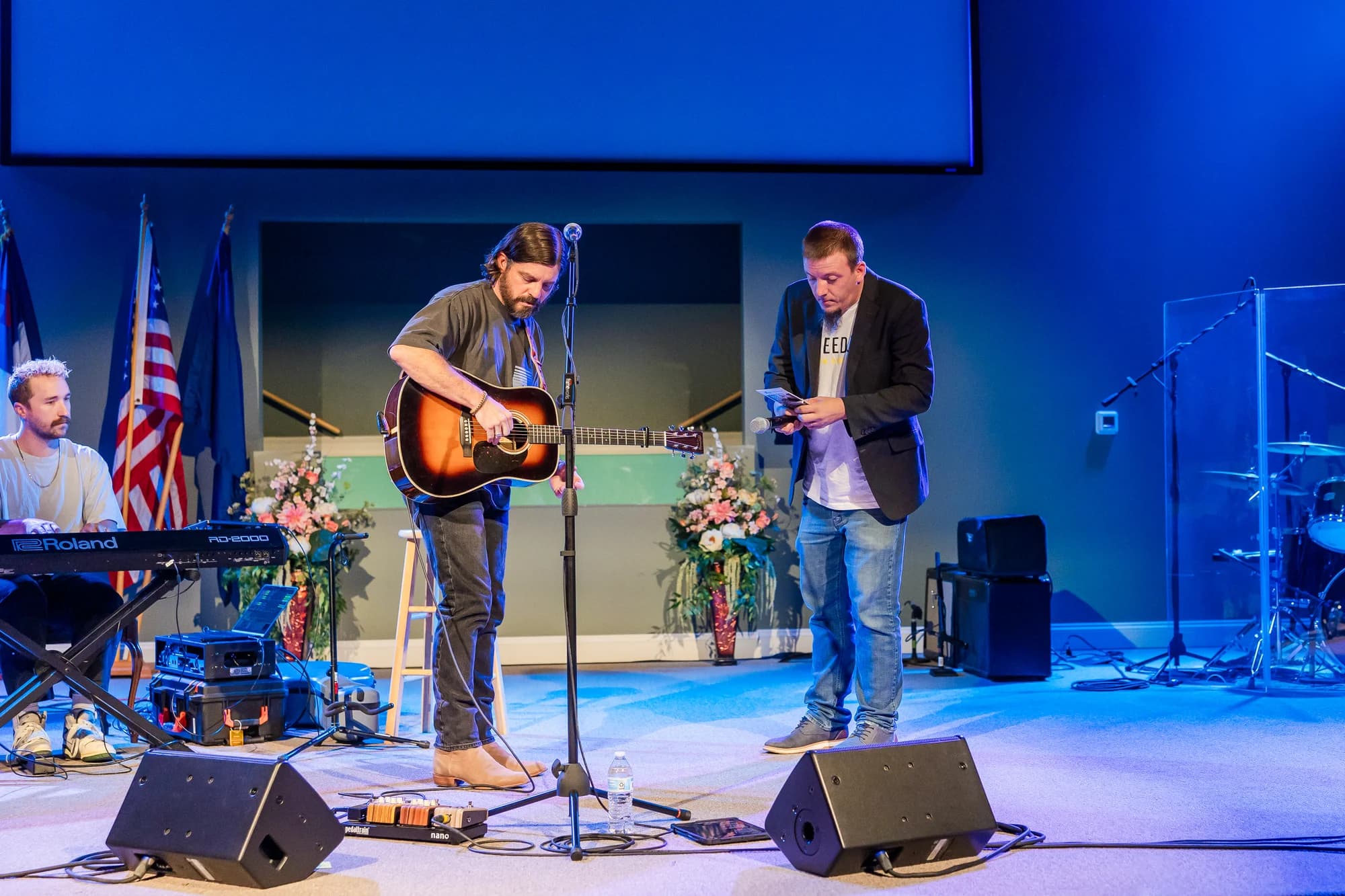 Justin and Josh Baldwin on stage at formal event