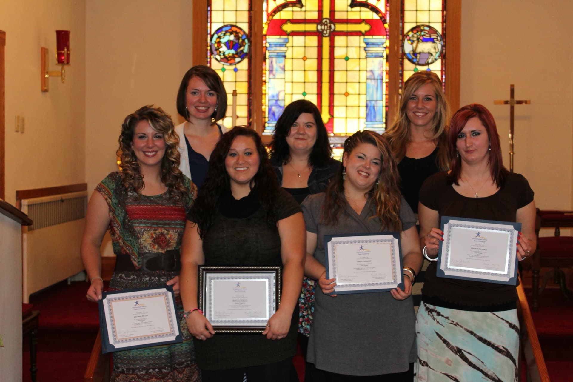 Women celebrating at a Teen Challenge graduation ceremony