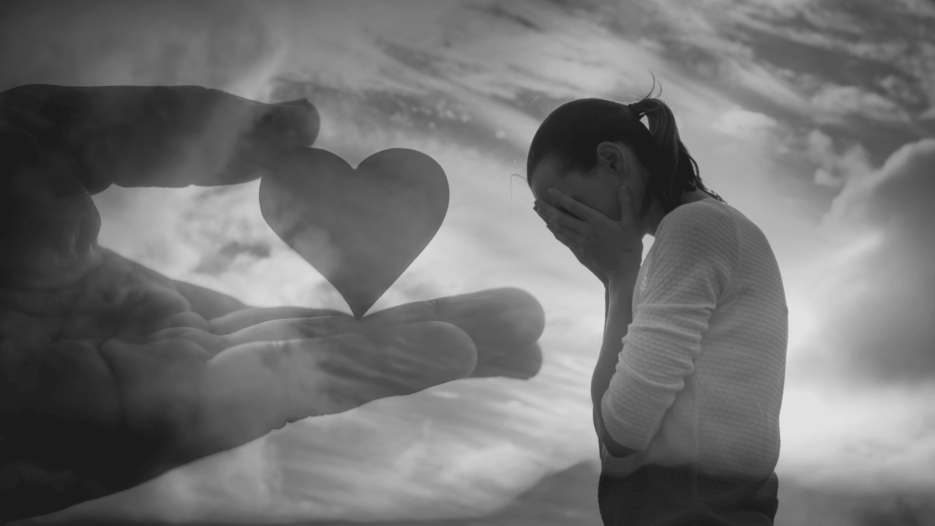 Person standing in hopeful posture looking toward light, representing moving beyond broken past through faith and God's restoration